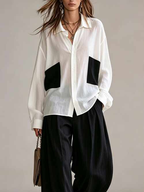 Conjunto Blanco y Negro: Camisa Oversize con Bolsillos de Parche y Pantalón Ancho de Talle Alto con Bajo a Rayas
